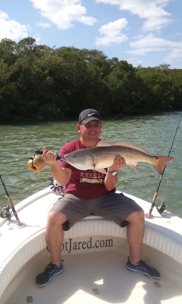 Mark with a over slot redfish he caught while on a fishing charter in Clearwater, FL. 