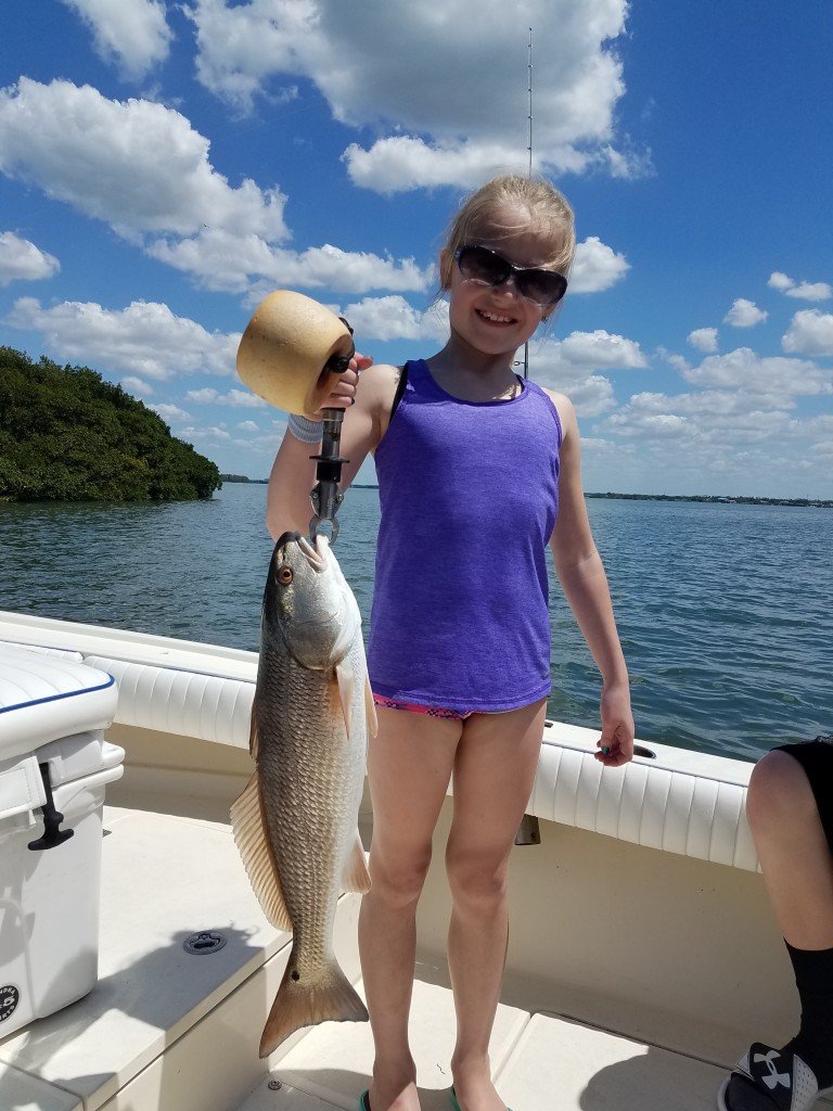 Brooklynn Big redfish fishing on tour in clearwater beach florida