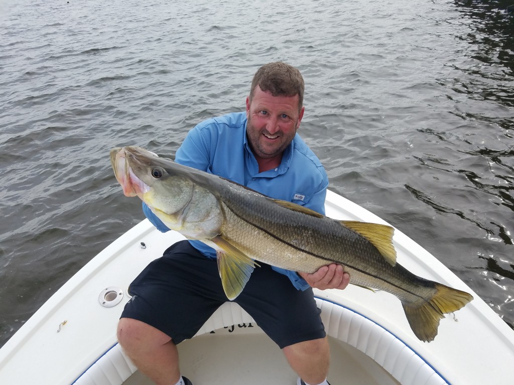 Bryan with huge snook caught while fishing with captain jared in dunedin florida