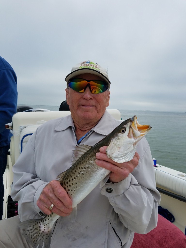 Joe with a nice trout caught on a Dunedin Fishing Charter