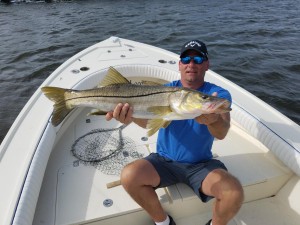 Dan with big snook caught while on a fishing charter trip with captain jared simonetti