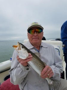 Joe with a nice trout caught on a Dunedin Fishing Charter