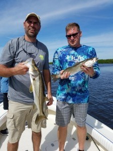 John Adam with a double hook up on a fishing charter in tampa florida